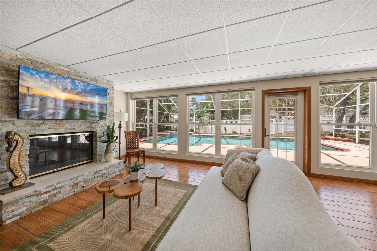 Create the perfect ambiance with a wood-burning fireplace overlooking the pool from the comfort of the great room.