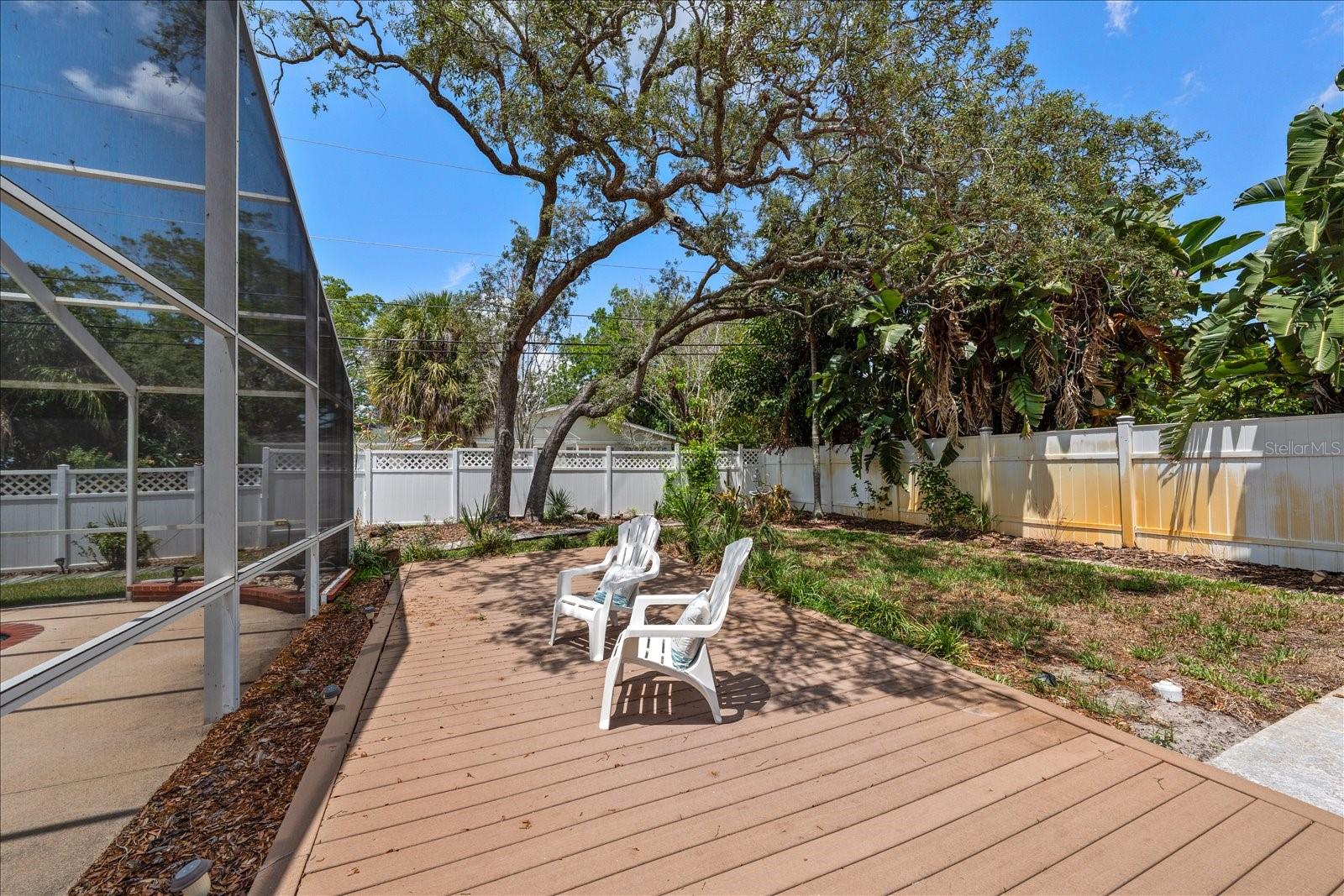 A large open deck offers an inviting outdoor retreat ideal for cookouts or sunbathing.