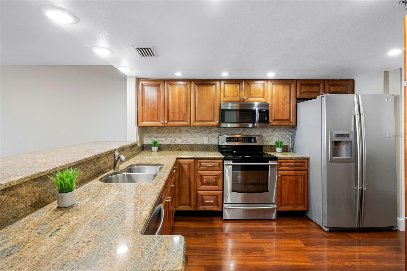 New Backsplash, granite and stainless kitchen
