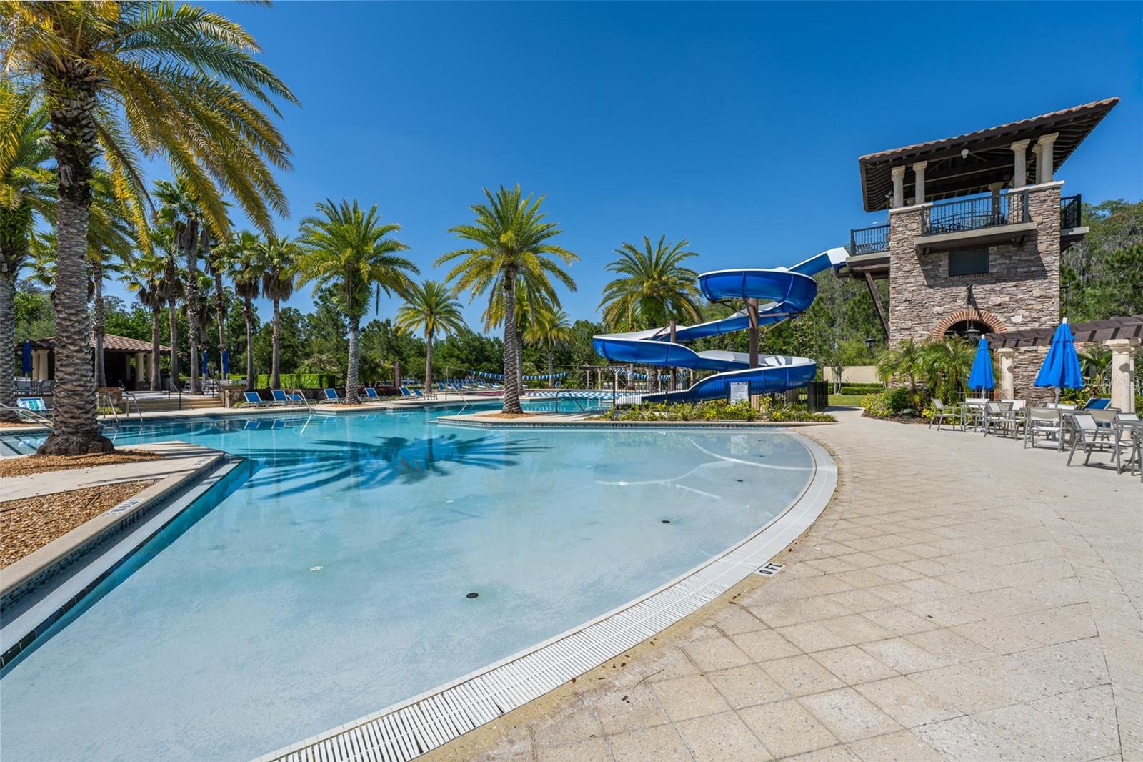 Resort zero entry side of  pool and Slide tower