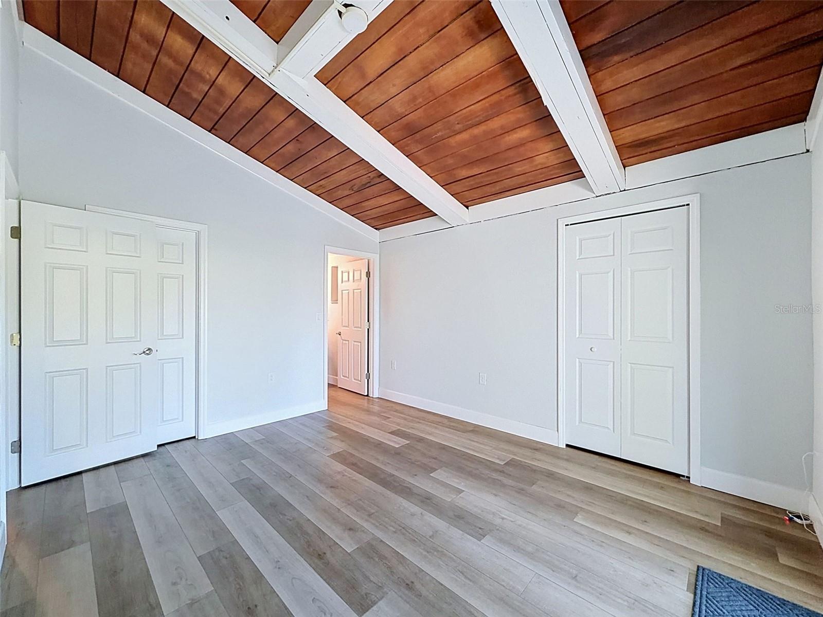 Comfortable primary retreat with updated flooring, generous layout, and ensuite bathroom connection.