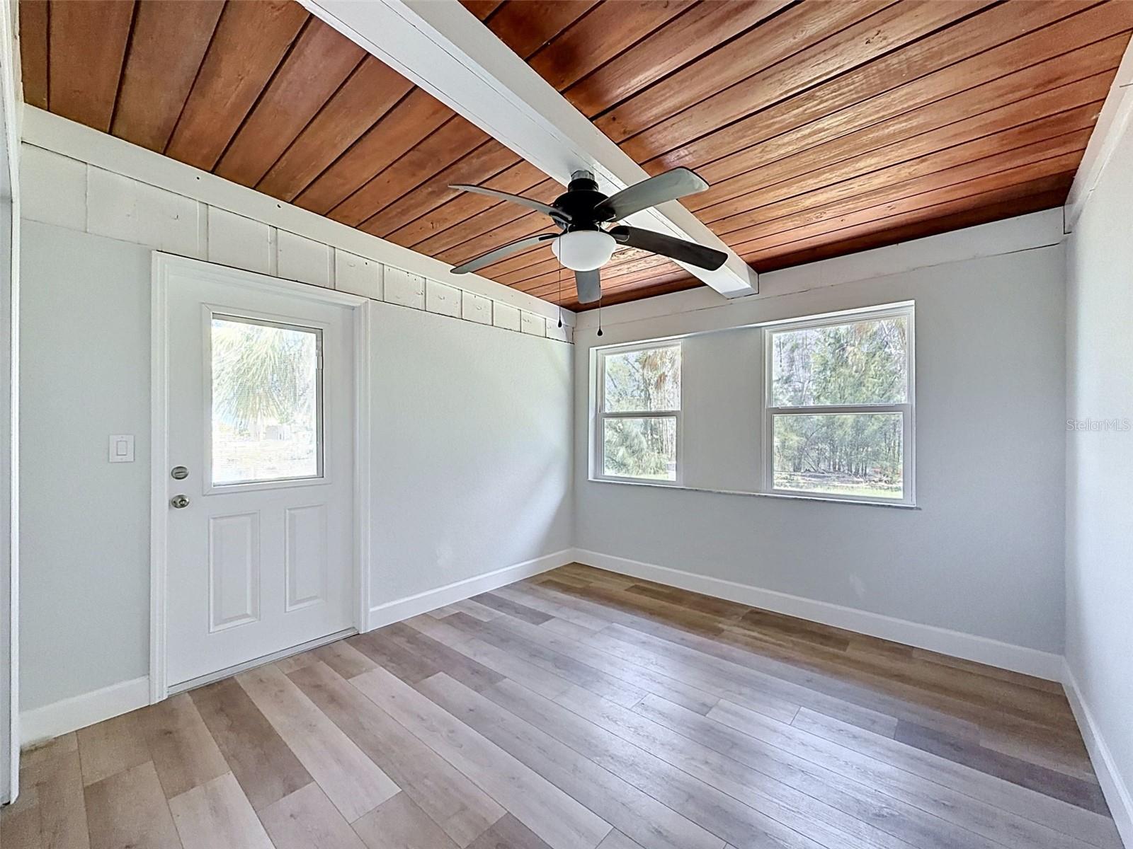 • Large flex room with washer/dryer hookups tucked behind double doors and direct outdoor access