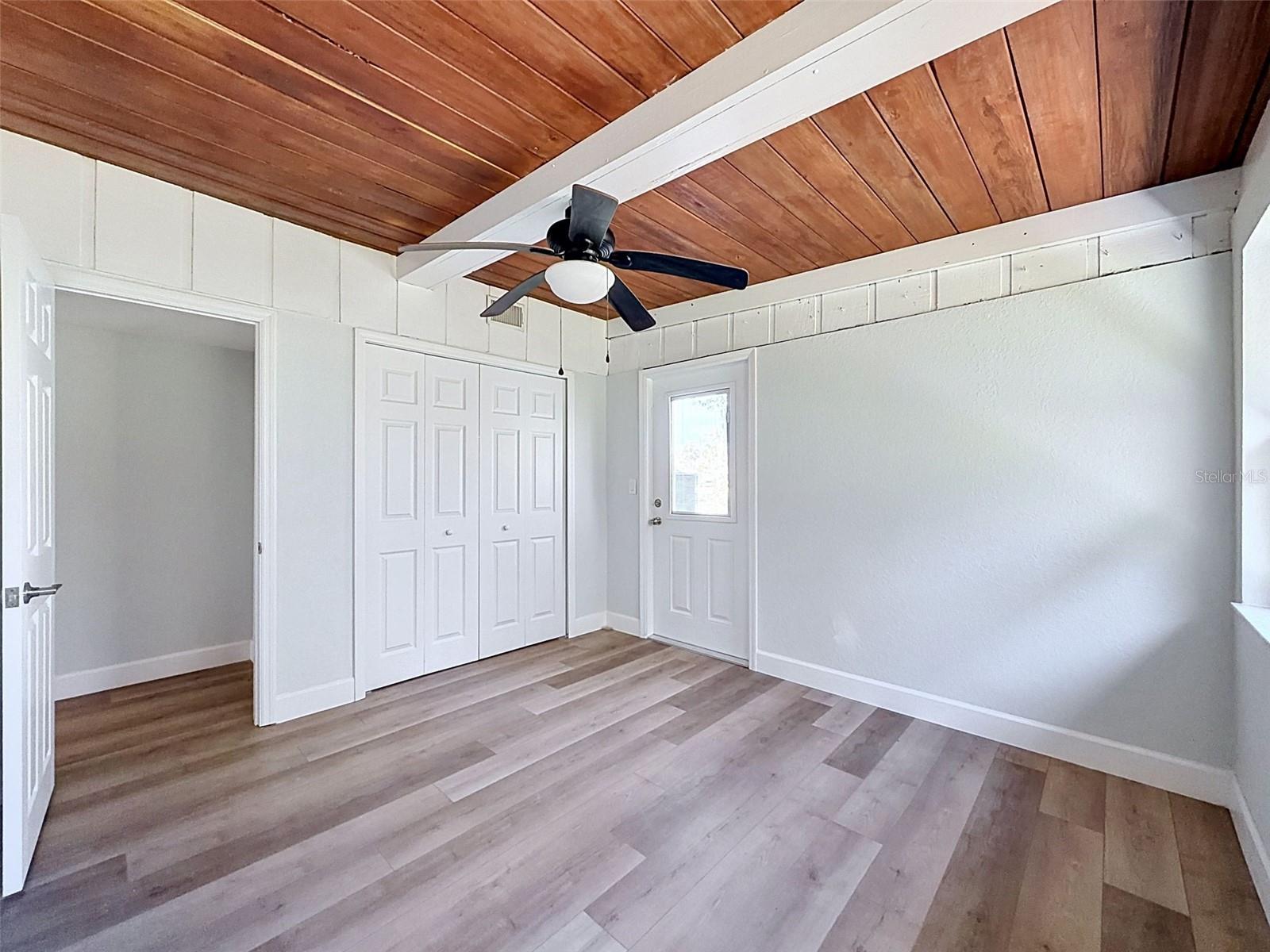• Spacious flex room featuring private exterior access and convenient indoor laundry closet.