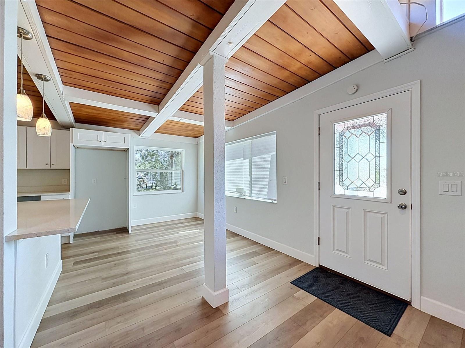 Open-concept living space with updated flooring and flexible furniture layout options.