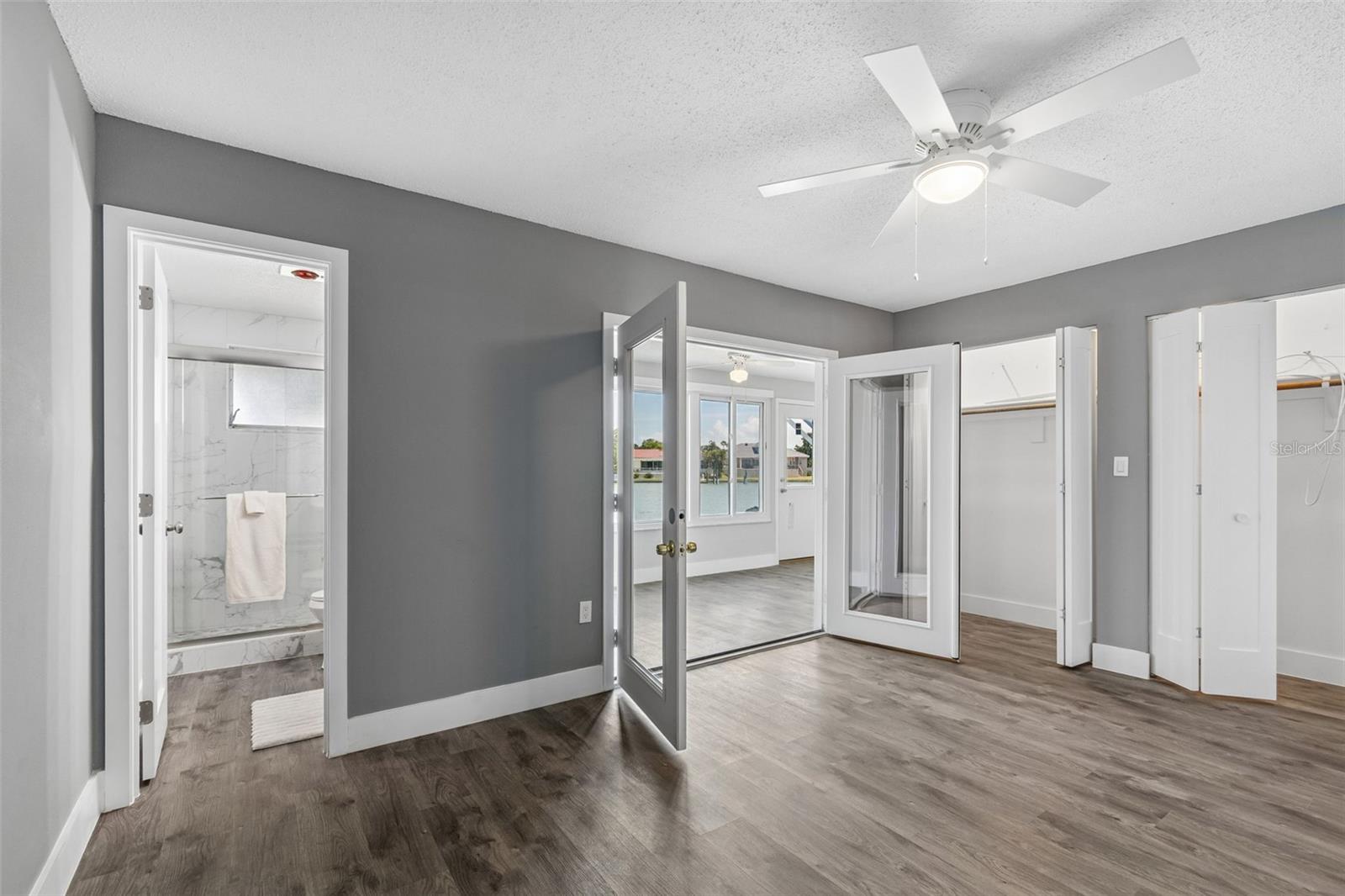 Primary Bedroom with French Doors out to the Florida Room