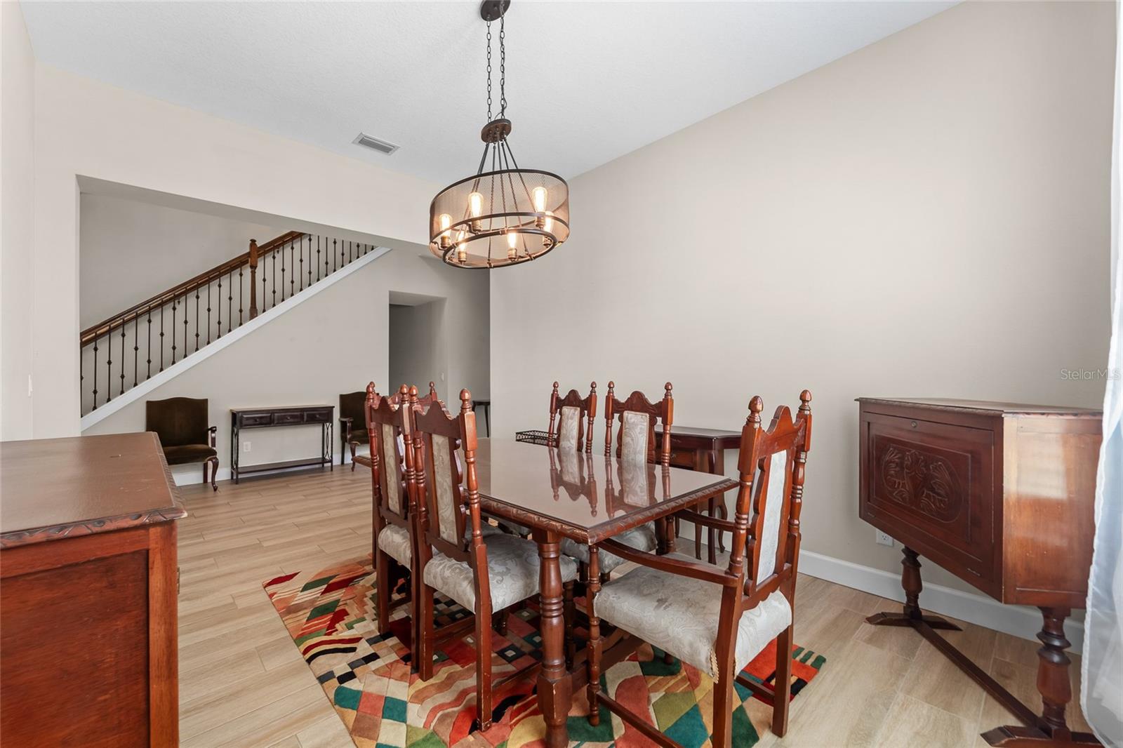 Formal dining room off the foyer — elegant, light-filled space perfect for hosting