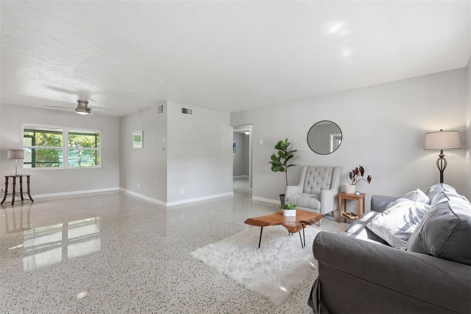 Livingroom with view of dining area in back left.