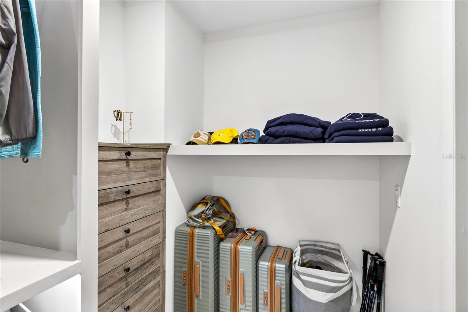 walk in closet with custom shelving