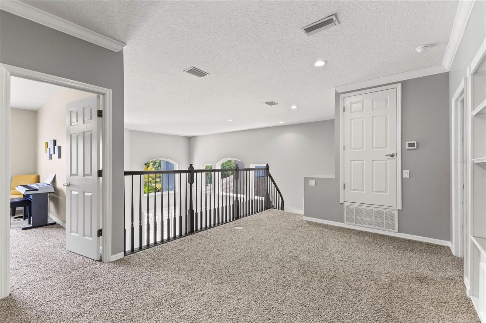 Loft area with built in shelving