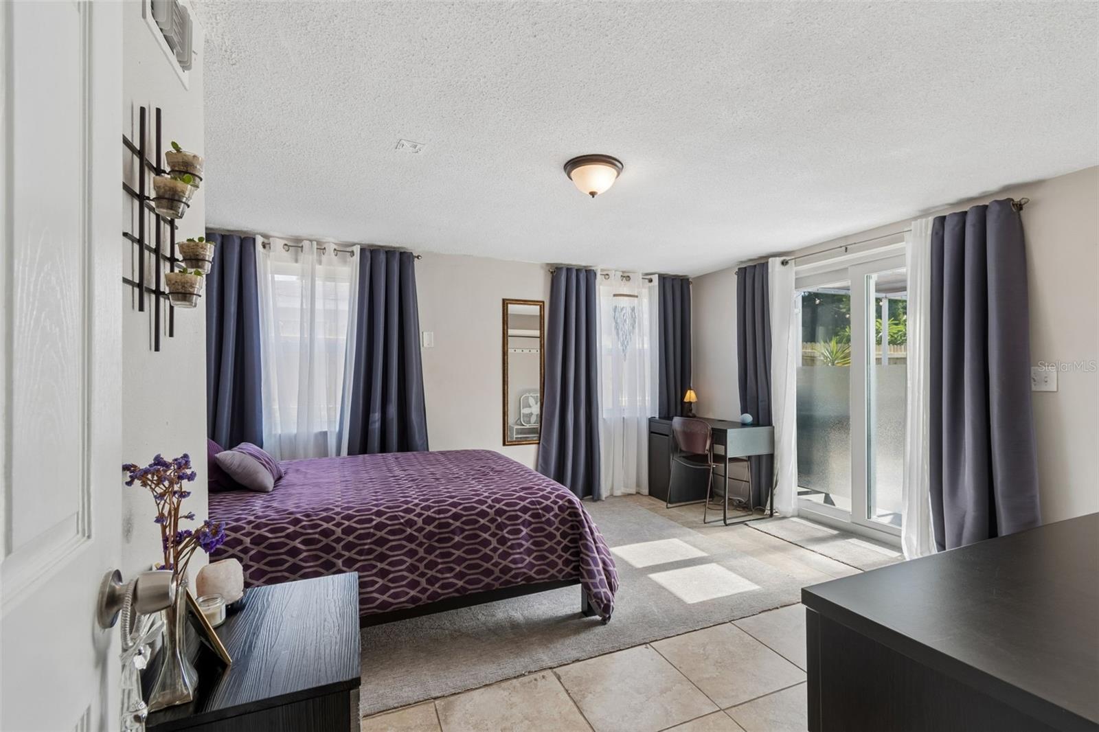 3rd Bedroom off of Family Room with sliders to pool