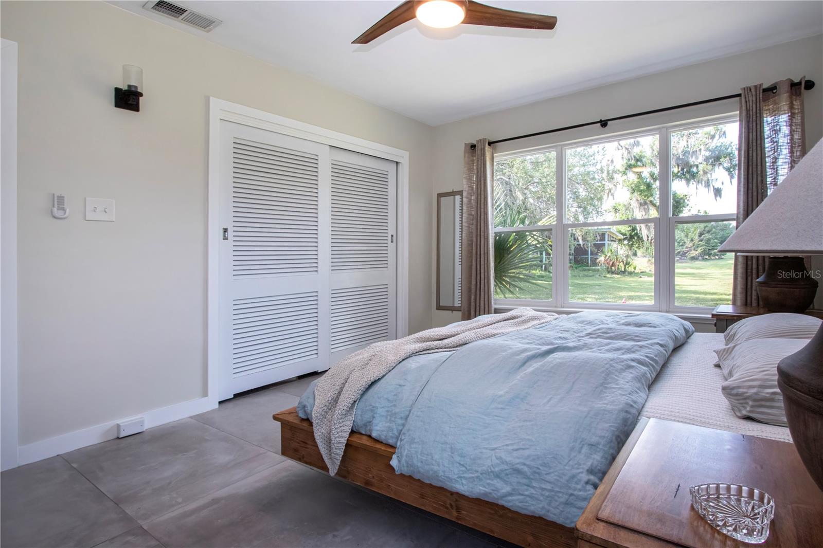 Owners suite view of closet and picture window