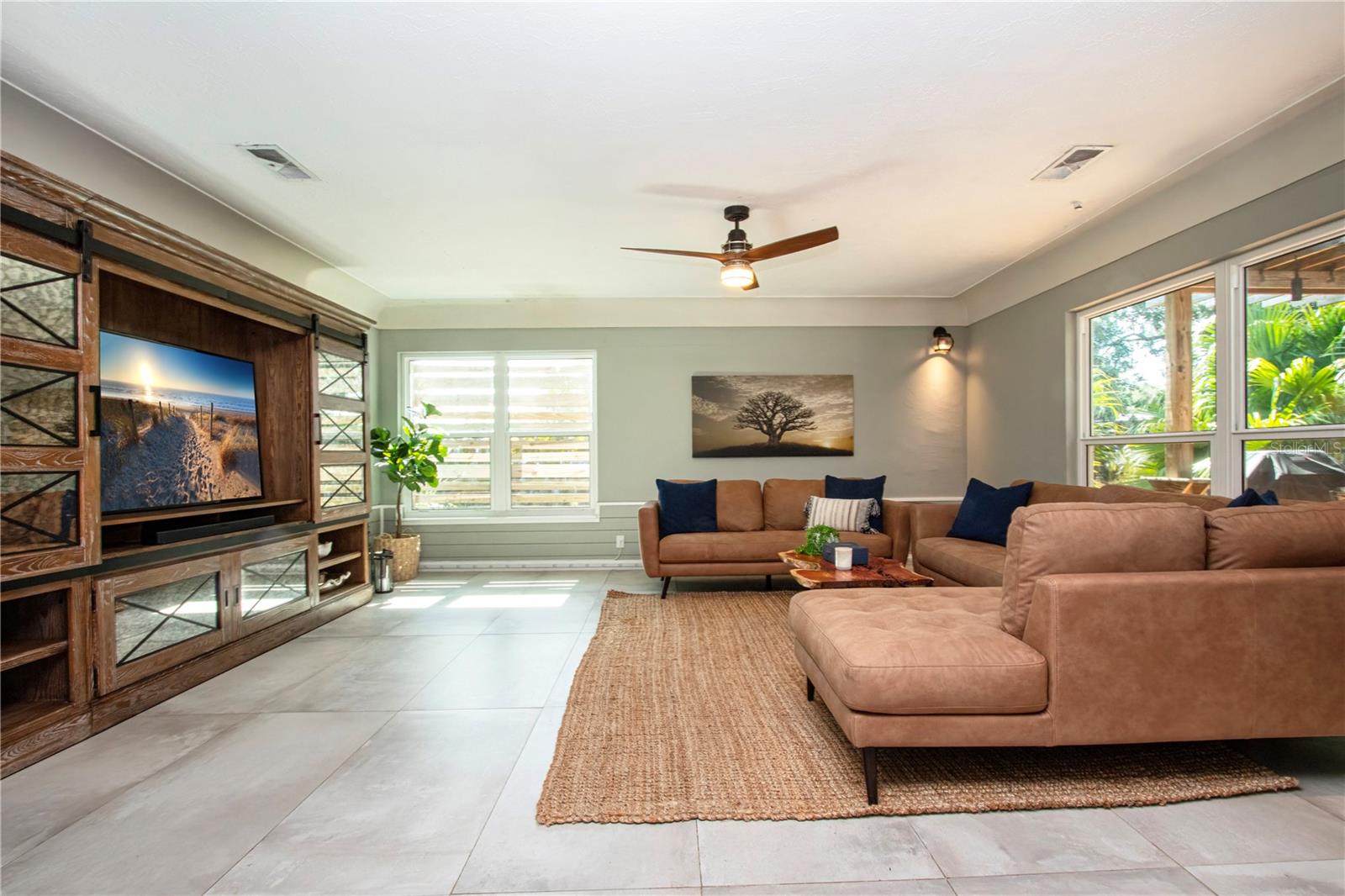 Modern living room with a view of the tropical pergola patio