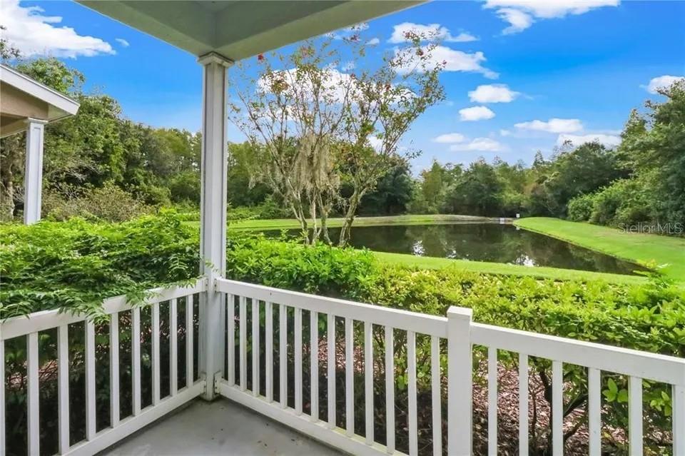 FRONT PORCH OVERLOOKING POND AND WOORDER AREA