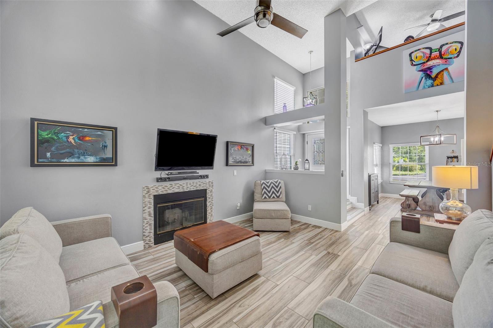 Living room with wood burning fireplace.