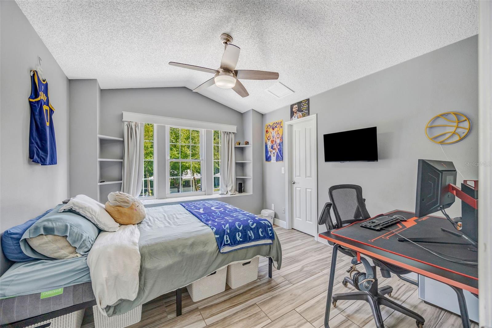 Bedroom 3 with boxed window seat window & large walk-in closet.