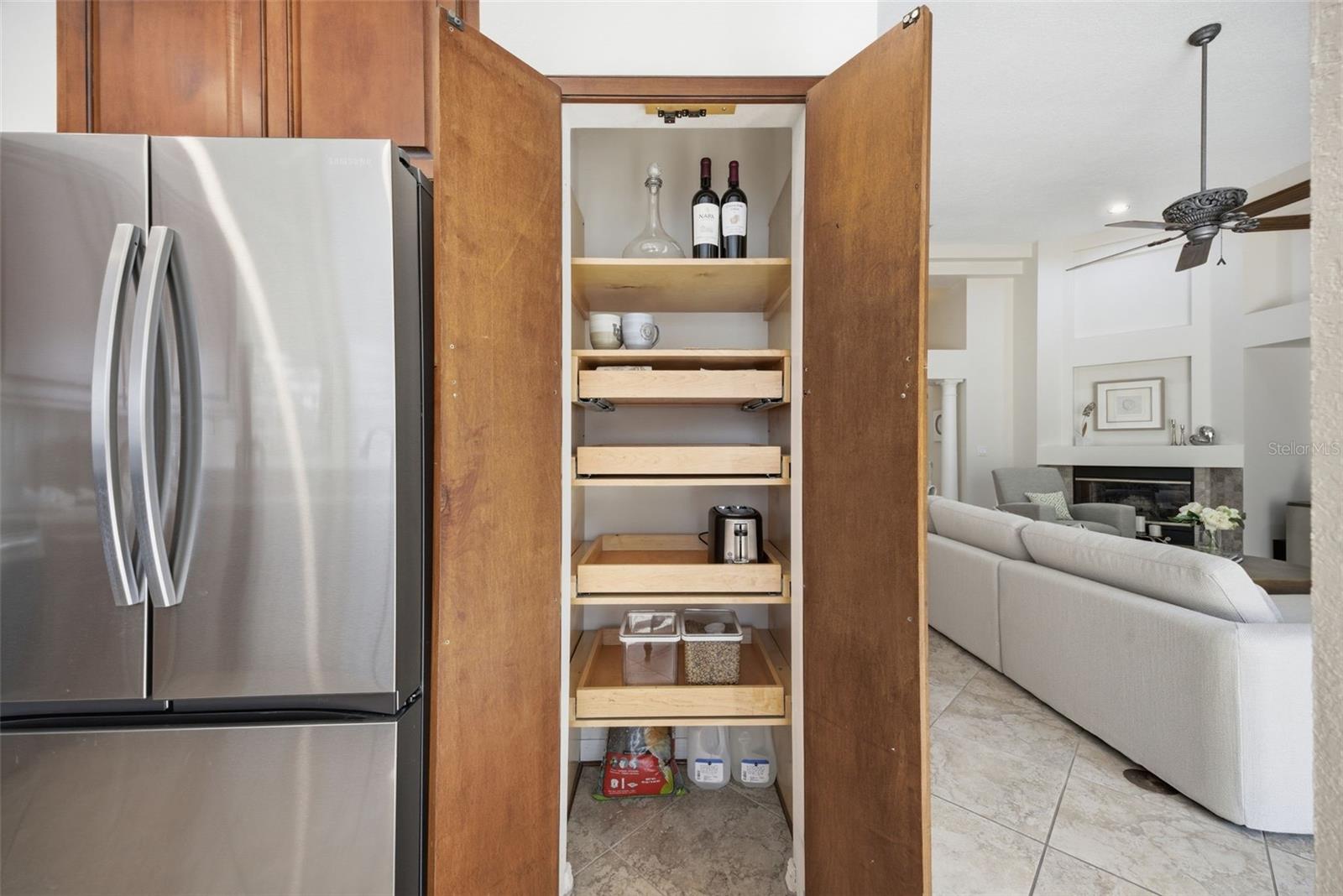 CABINETRY INCLUDES LAZY SUSANS AND UPGRADED WOOD PULL OUTS