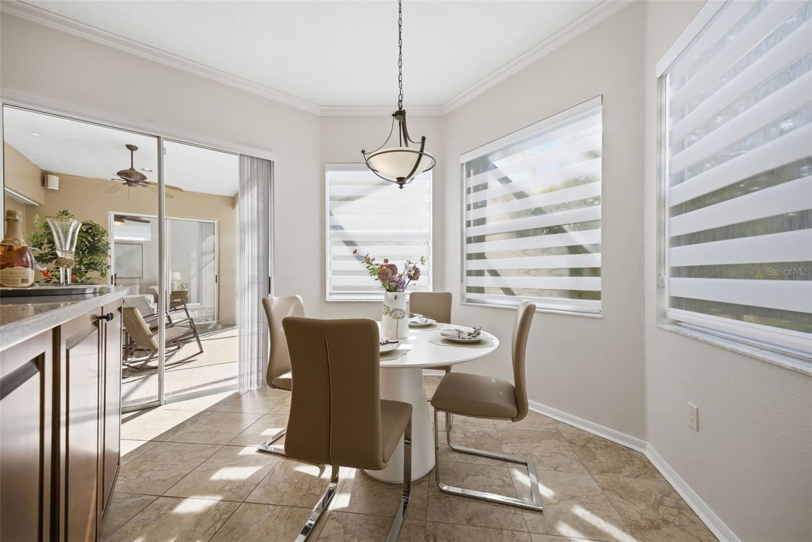 BREAKFAST AREA IN KITCHEN OVERLOOKING THE LANAI, BRAND NEW CUSTOM BLINDS