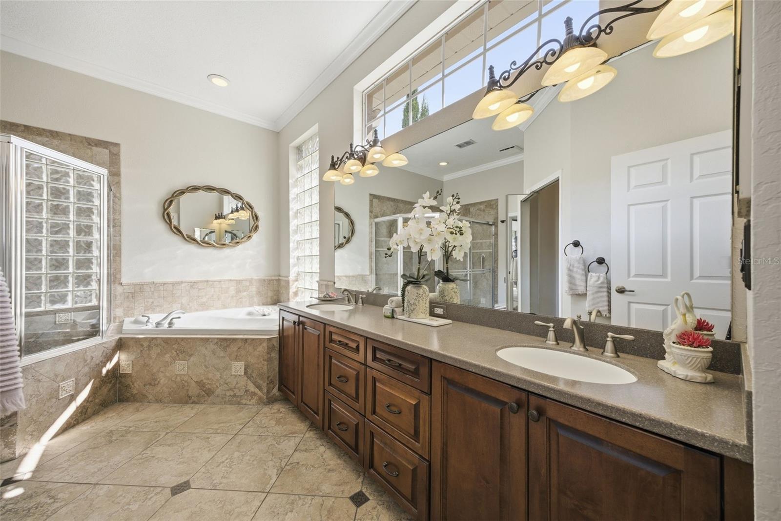 PRIMARY BATH HAS PLENTY OF STORAGE, COUNTER SPACE & DOUBLE SINKS
