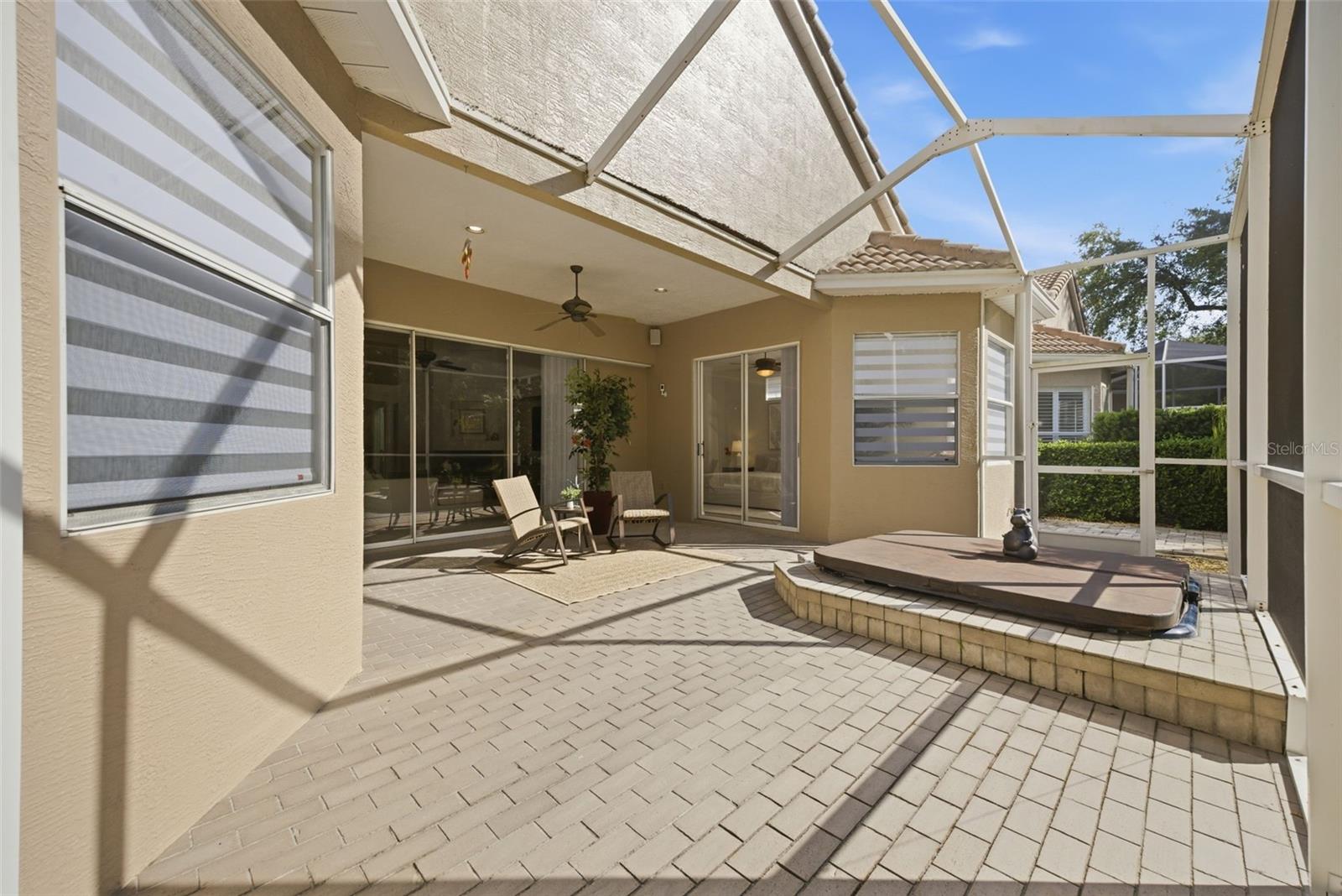 OVERSIZED PAVERED SCREENED LANAI WITH IN-GROUND SPA