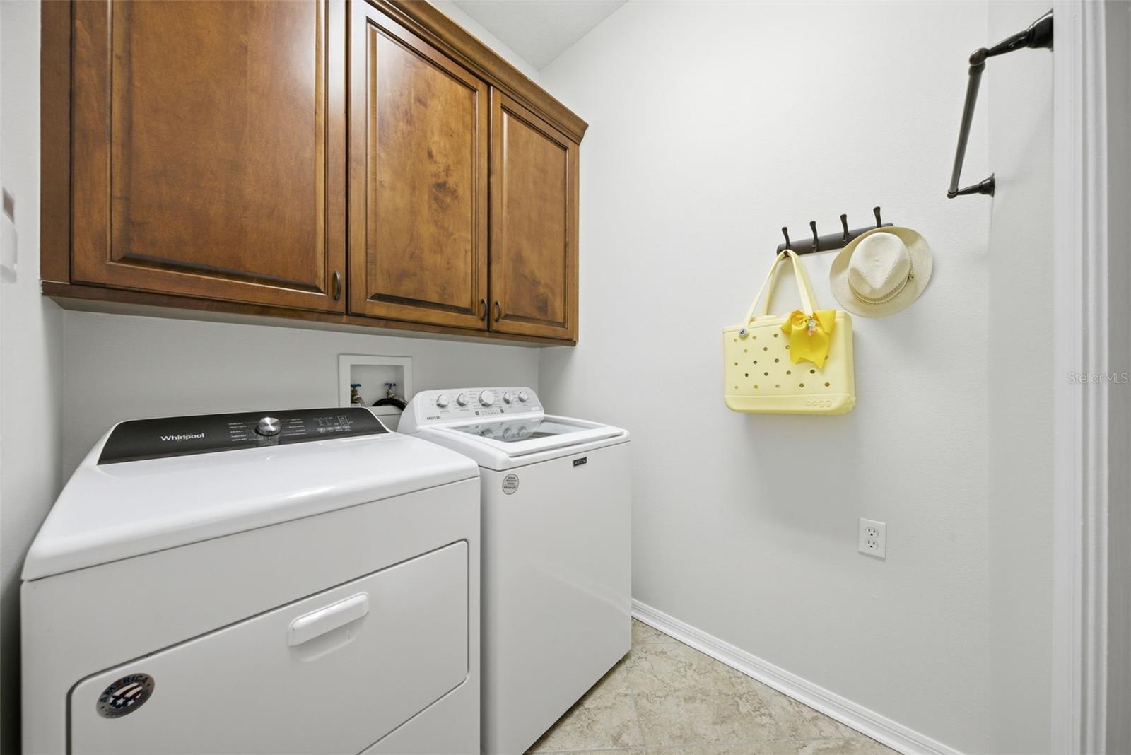 INDOOR LAUNDRY ROOM LEADS TO THE TWO CAR GARAGE