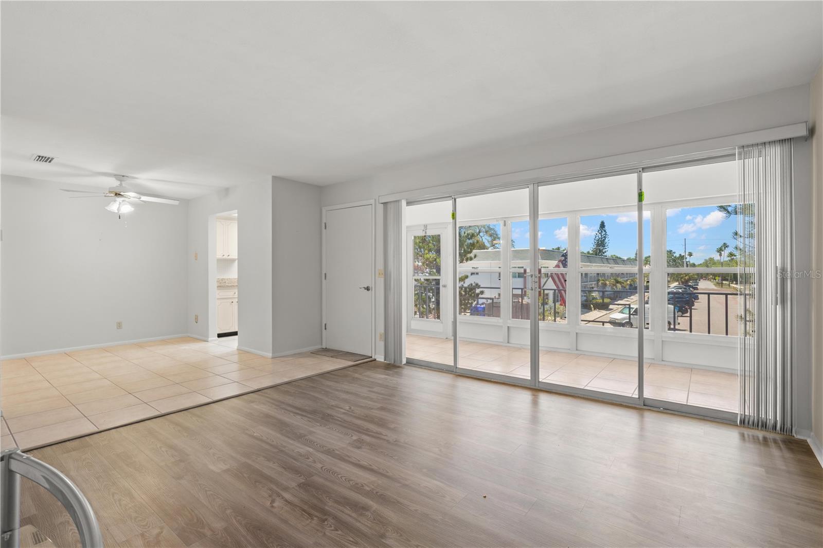 Living Room with wall of sliders to oversized lanai