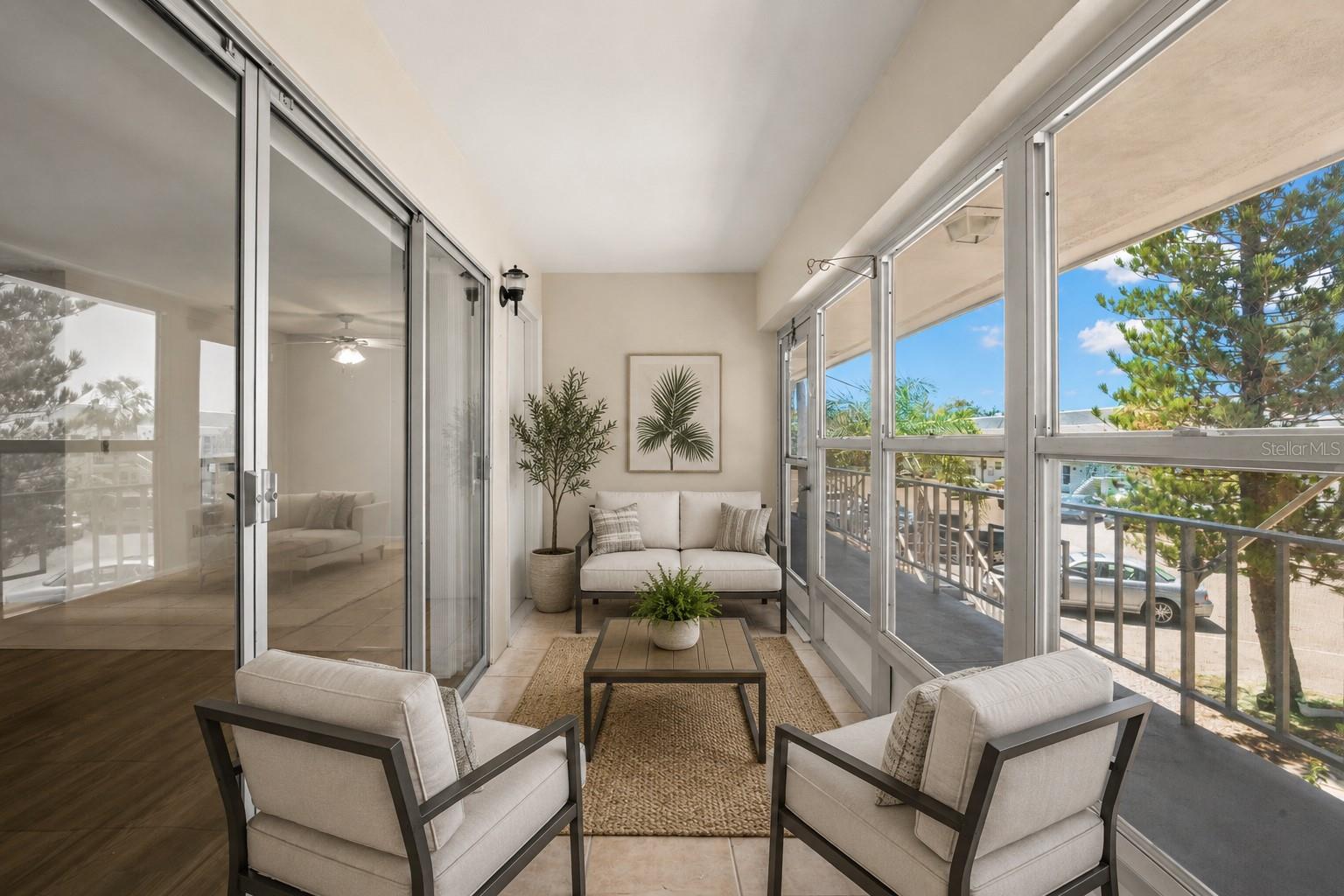 Virtual staging. Oversized enclosed lanai with windows that open for fresh air and Florida breezes