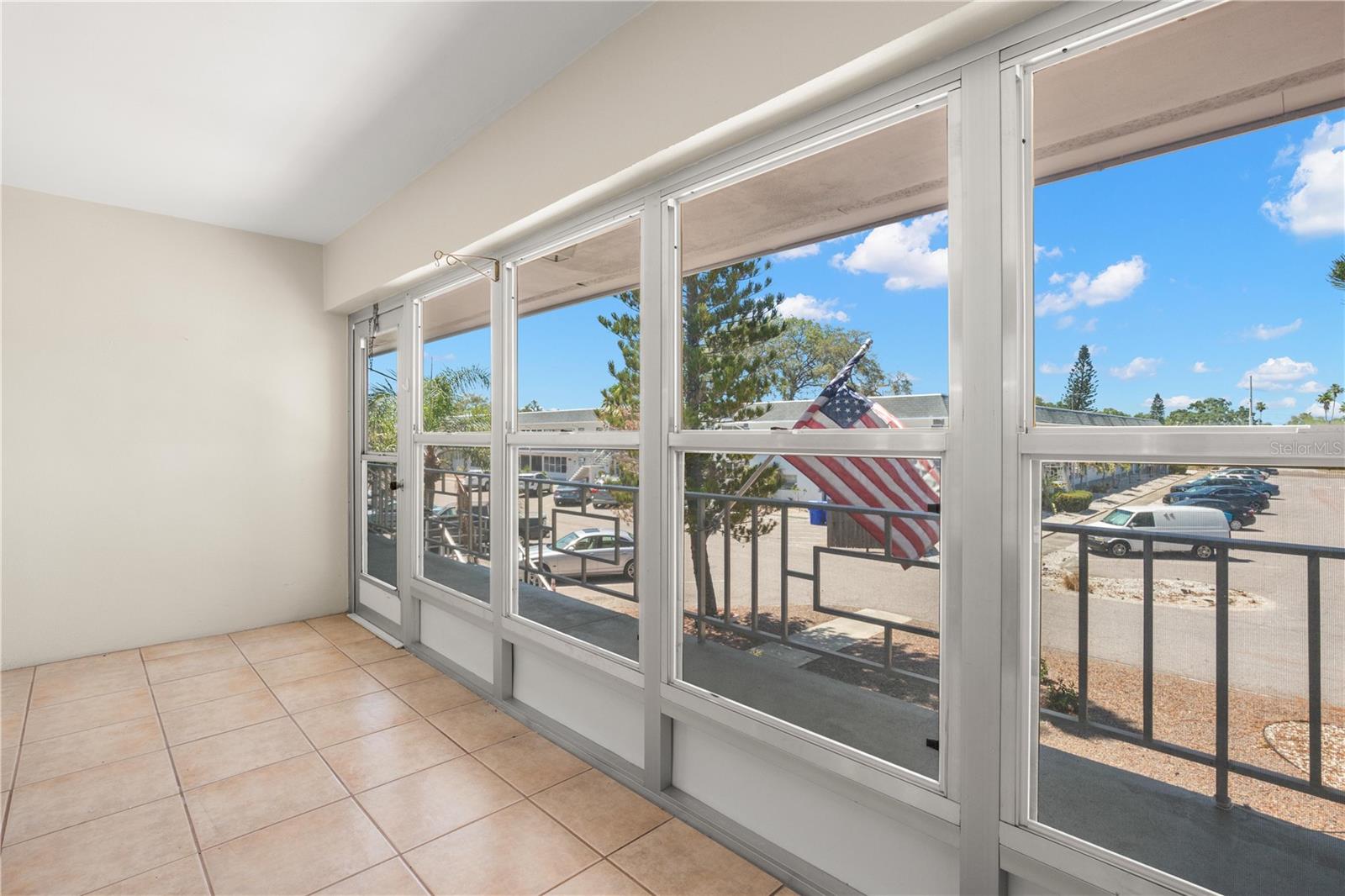 Oversized enclosed lanai with windows that open for fresh air and Florida breezes