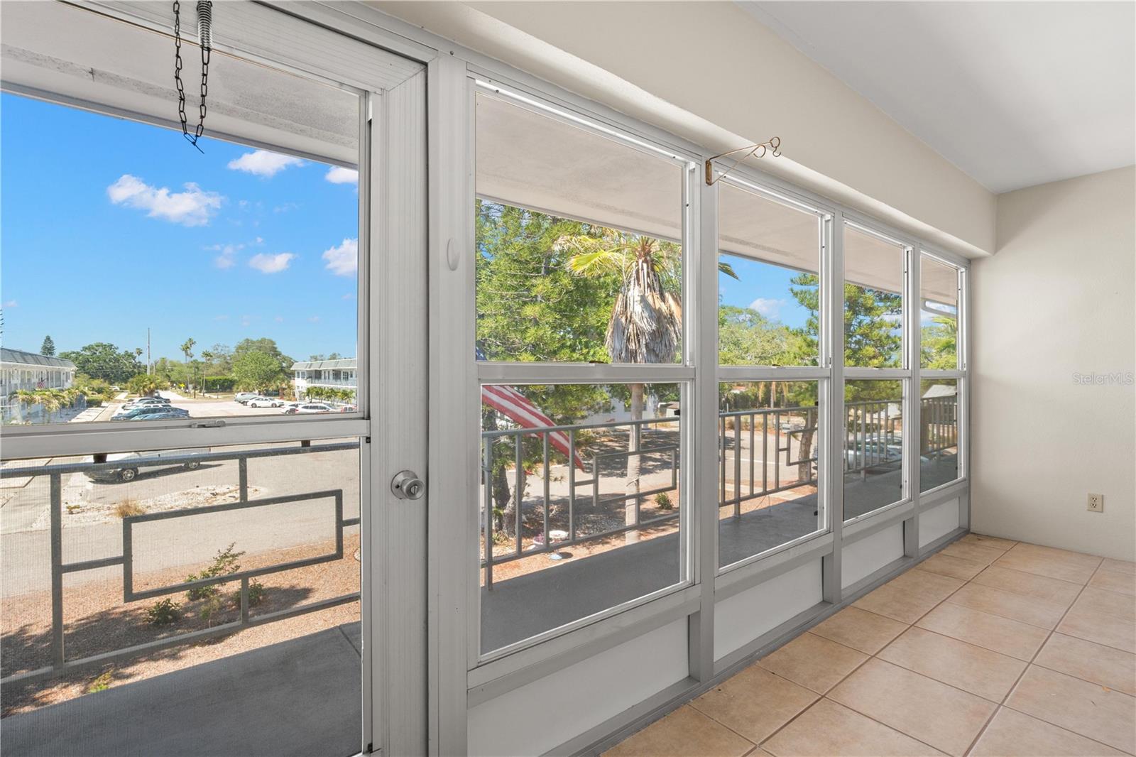 Oversized enclosed lanai with windows that open for fresh air and Florida breezes