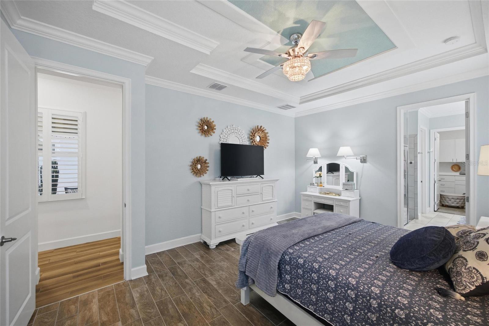 Primary bedroom with ensuite bath and walk-in closet.