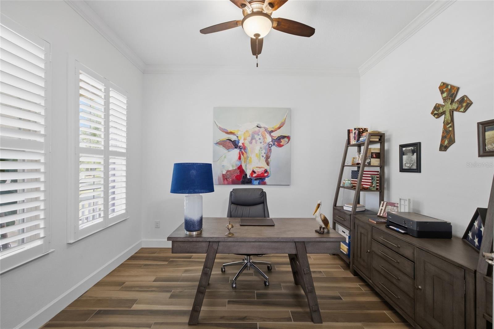 Bonus den / office overlooking the beautiful front yard green space.