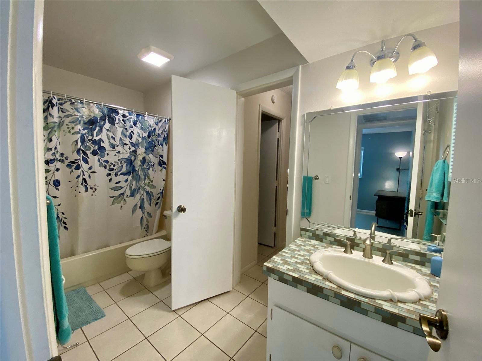 Bathroom with dual access - door leads to primary bedroom