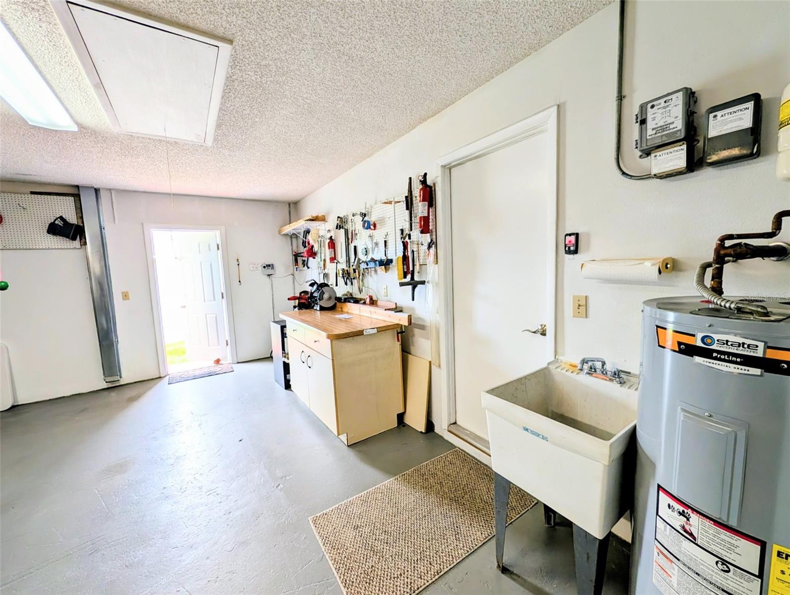 Utility sink and pull down attic
