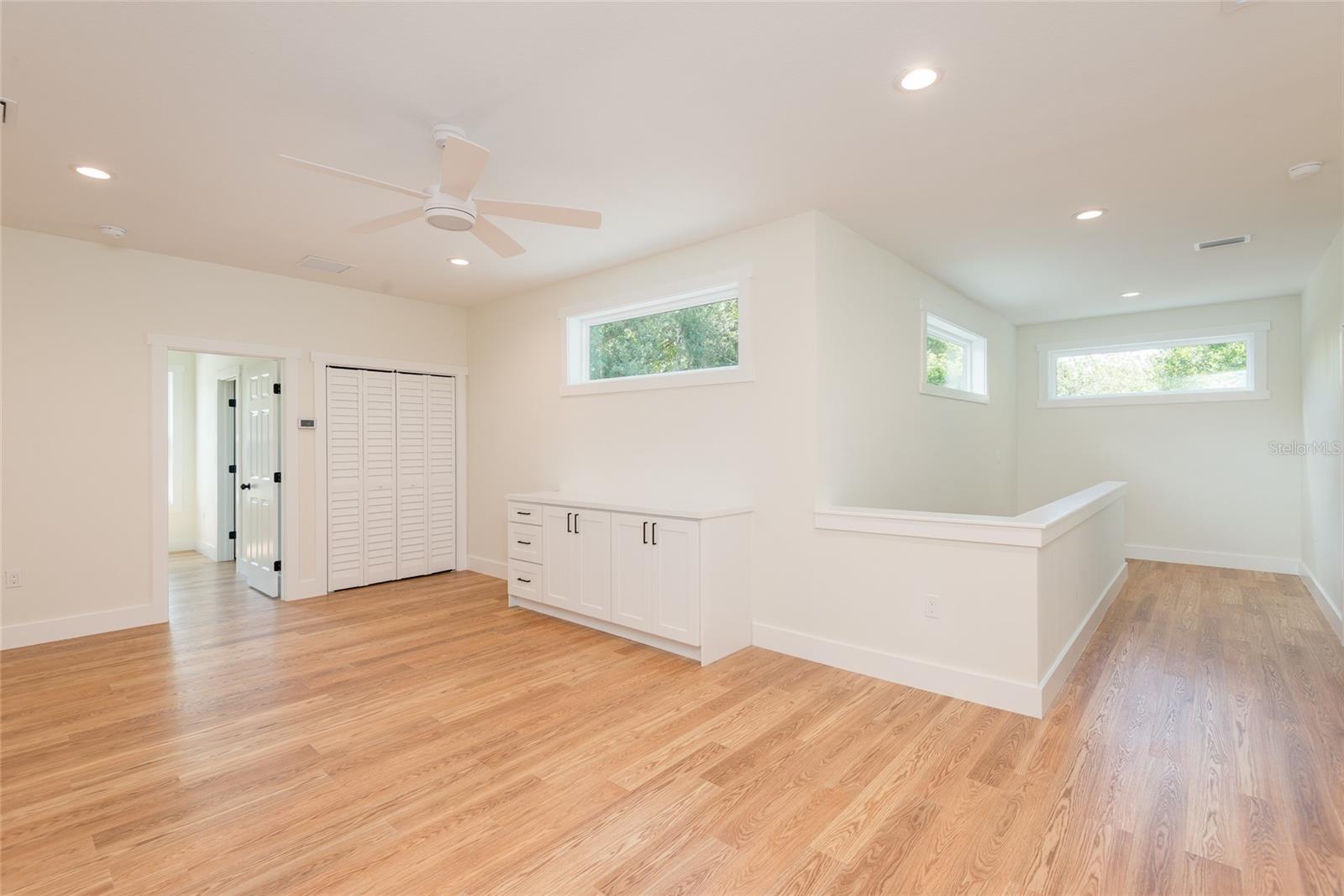 Upstairs loft area with transom windows.