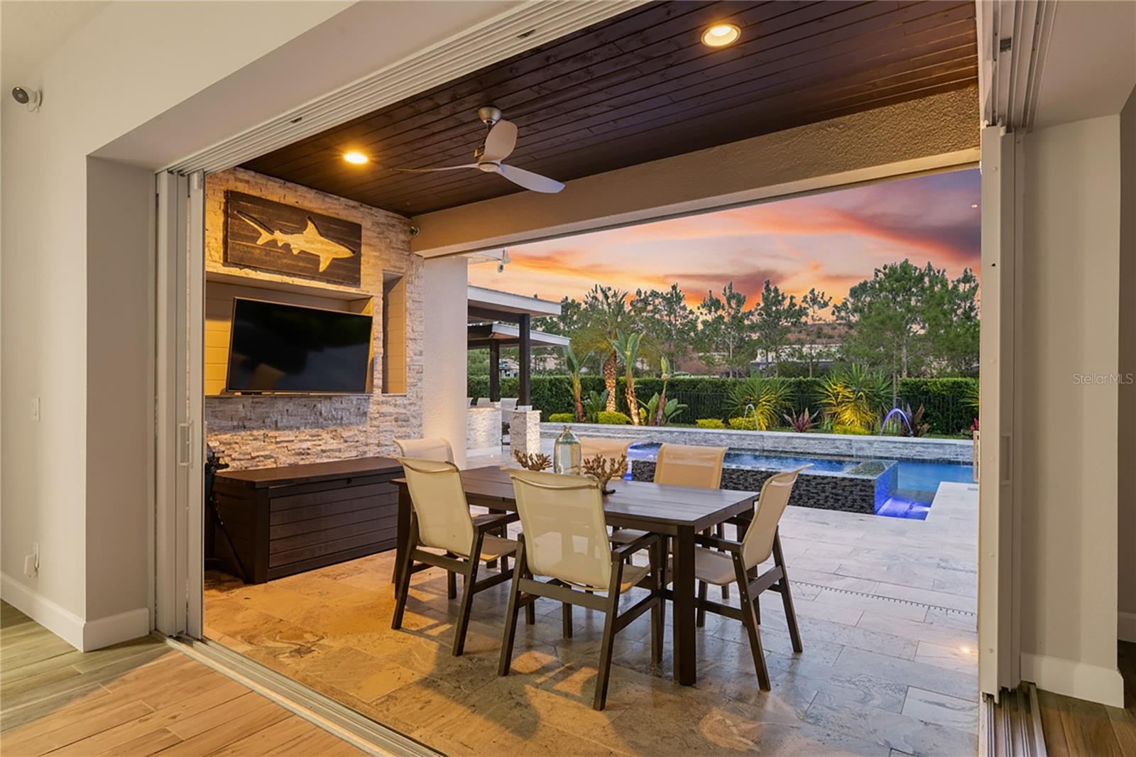 Twilight view of patio and pool