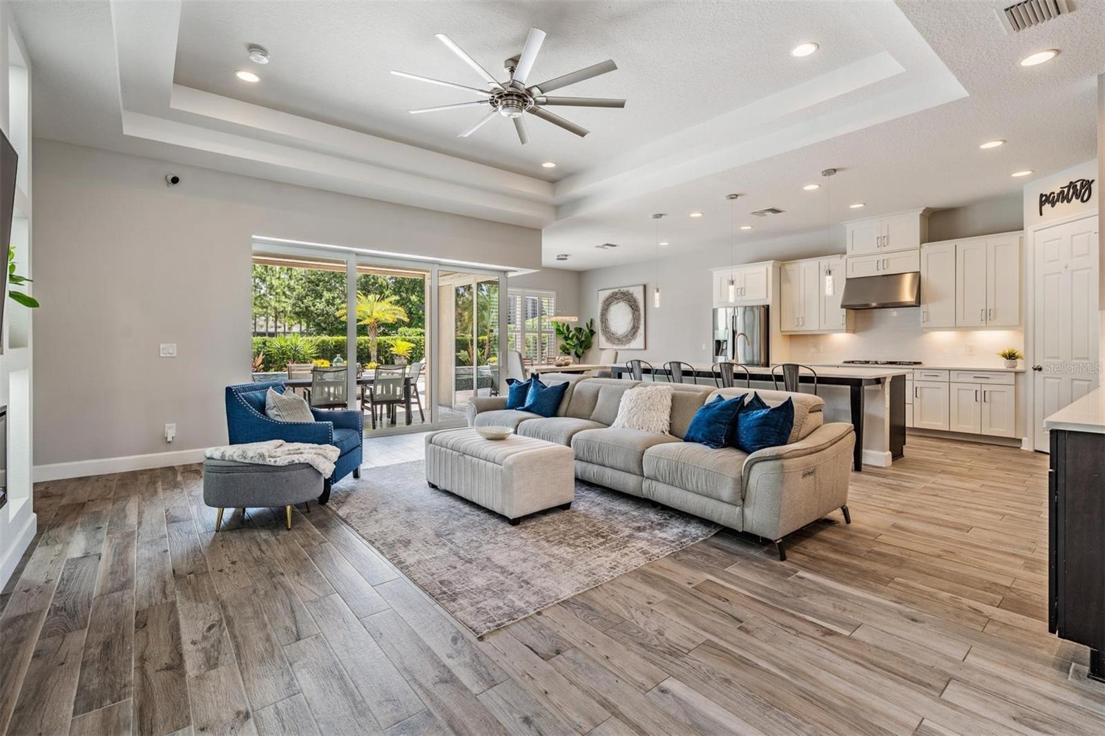 Open and airy great room with backyard views