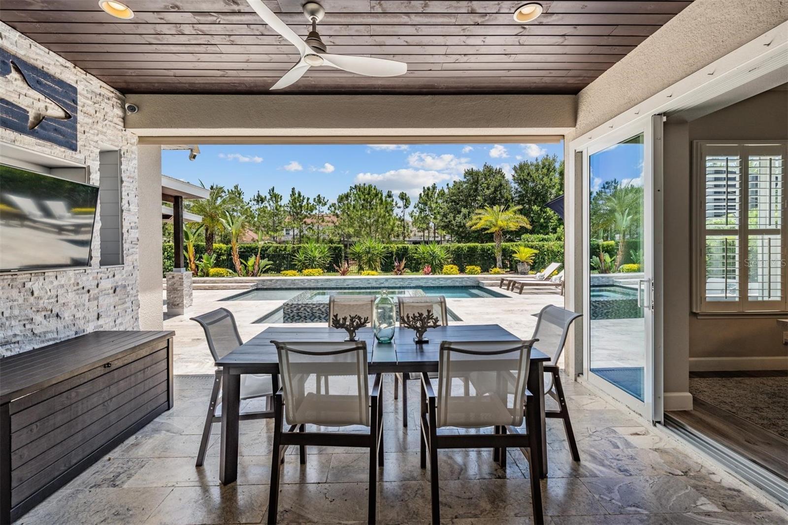 Outdoor dining with pool view