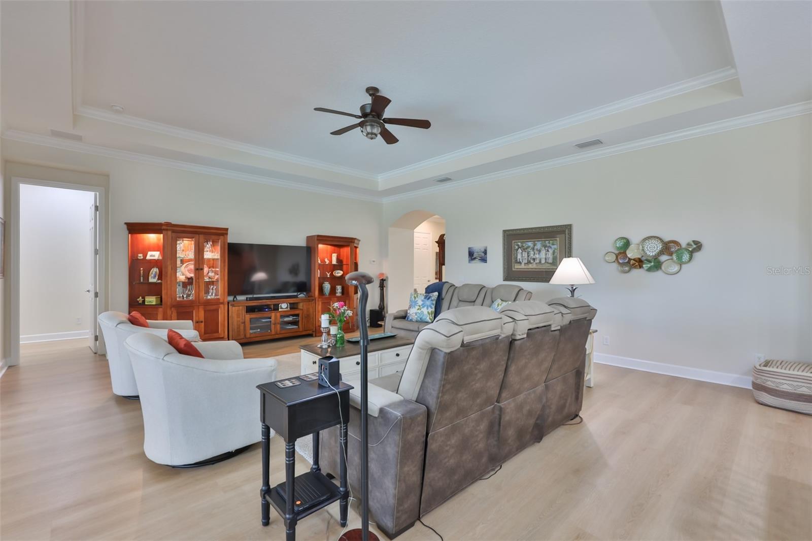 Arched doorways, large rooms and high ceilings make this an elegant and relaxing room for family and friends.