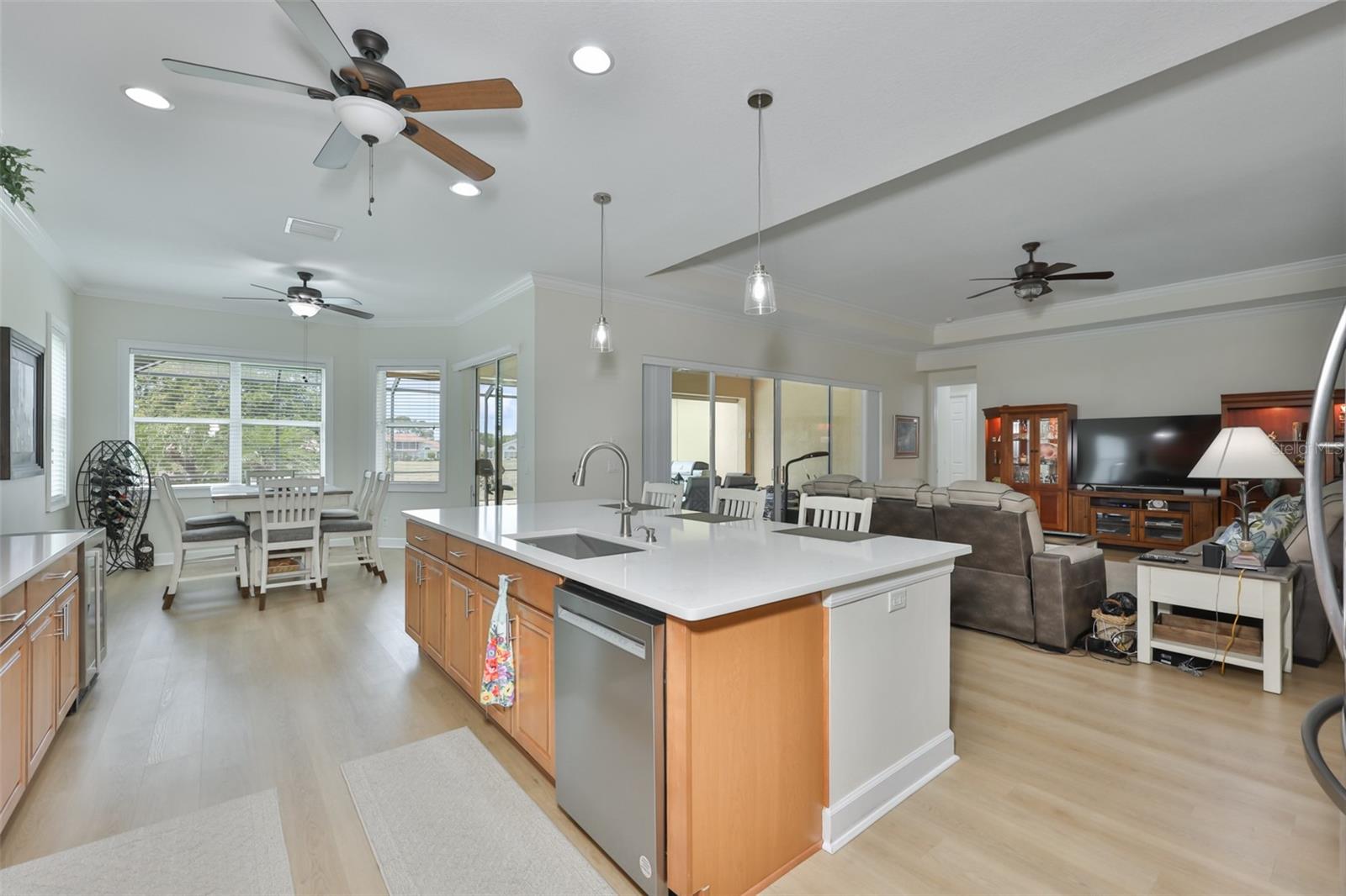 The kitchen boasts of high end cabinetry and is right in the middle of all of the action.