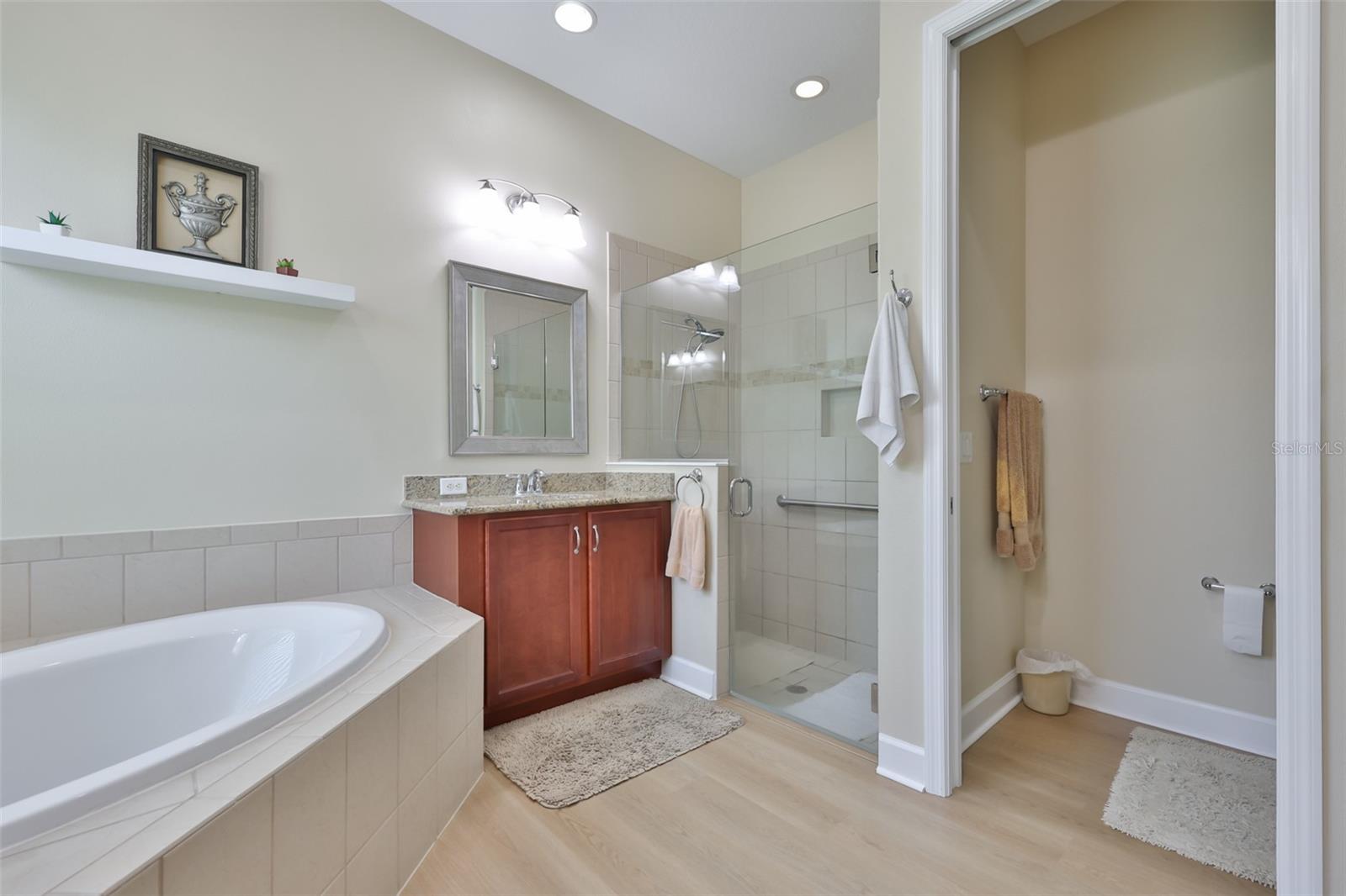Large walk in shower, private water closet and again, the continuous waterproof flooring.