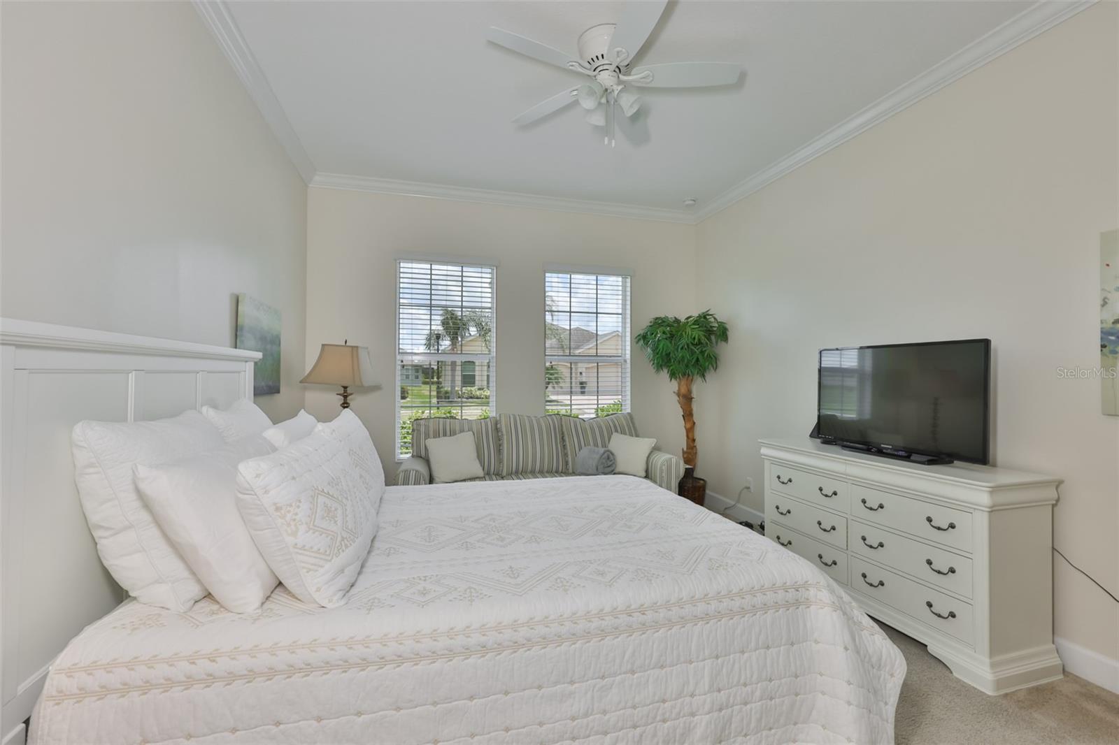 Notice the neutral paint tones, crown molding and comfortable environment.