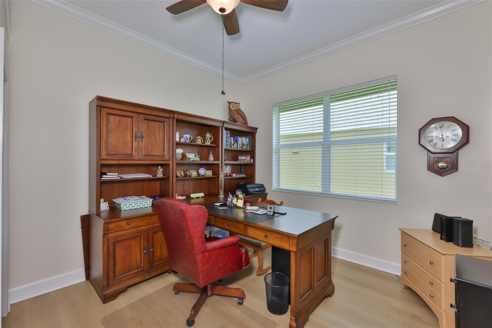 The room is bright with oversized double windows.  Notice the modern flooring is continued throughout the home.