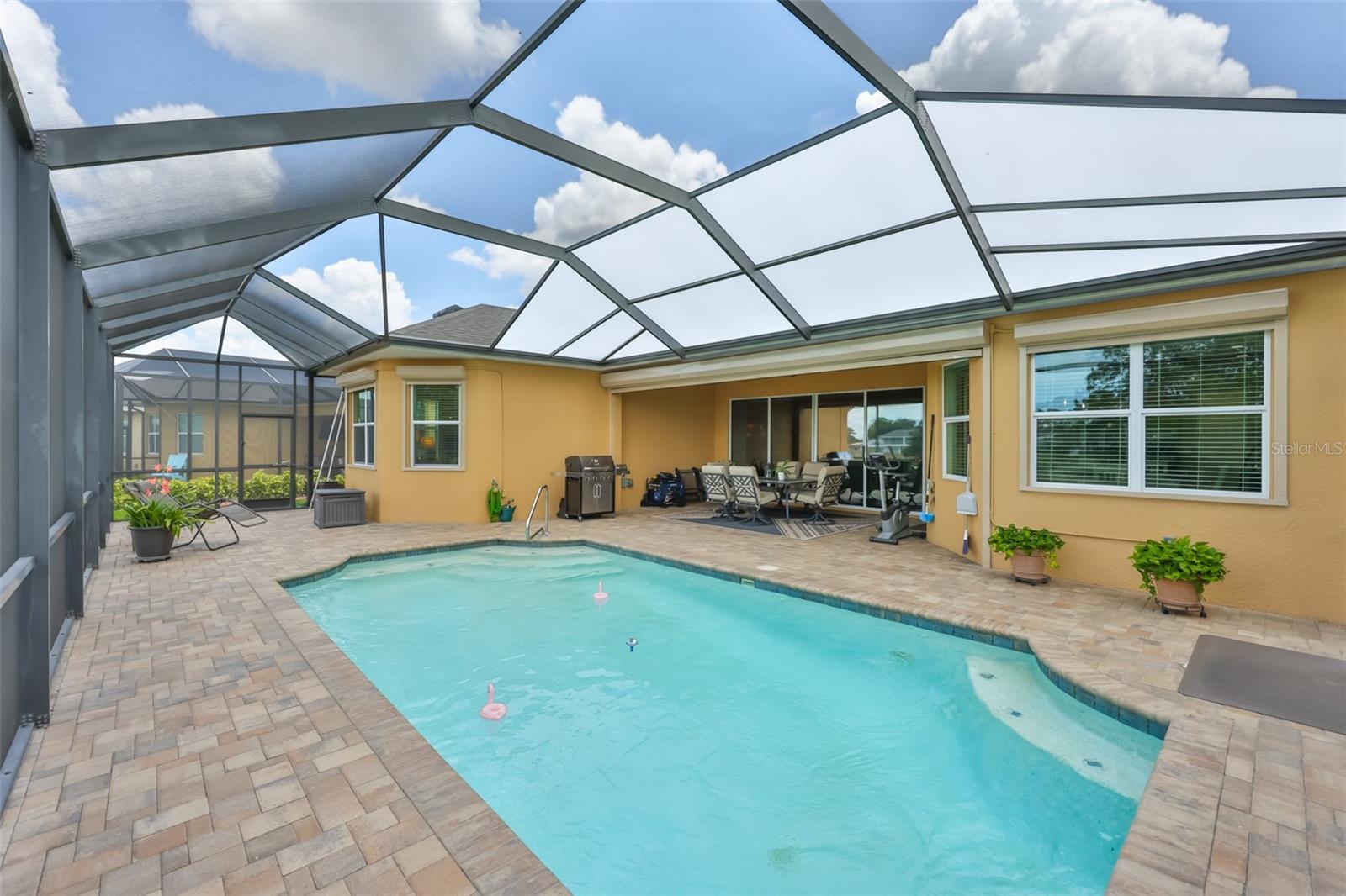 The pool starts at 3' and goes to 8' deep with a bench and Florida sunshades.