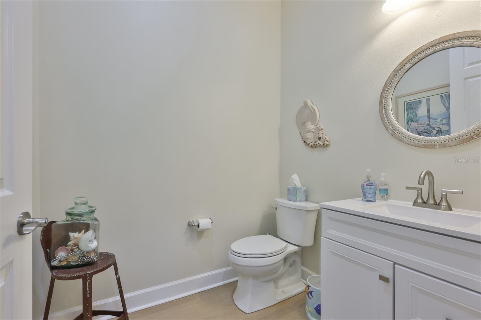 The 'powder room' is just off of the foyer for easy access for guests and privacy for anyone occupying the bedrooms.  Note the high toilets!