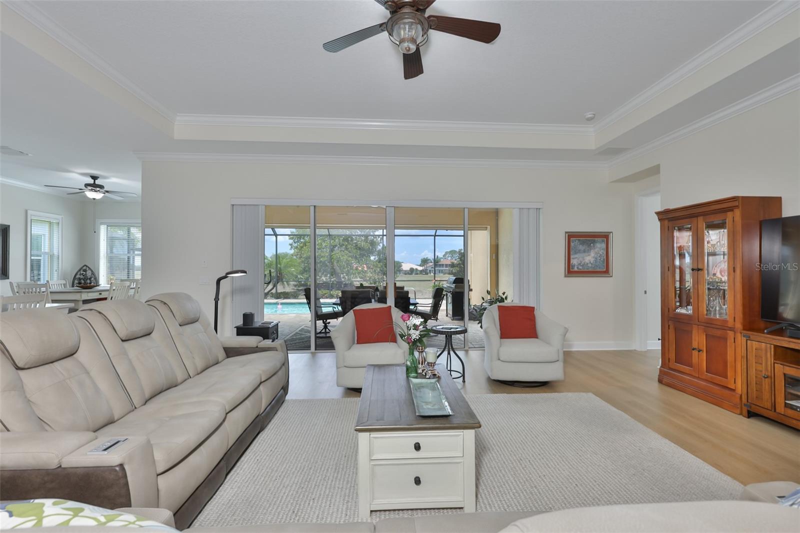 Bright, open and spacious, this great room is perfect for relaxing or entertaining.  Notice the trey ceiling and crown molding throughout the home.