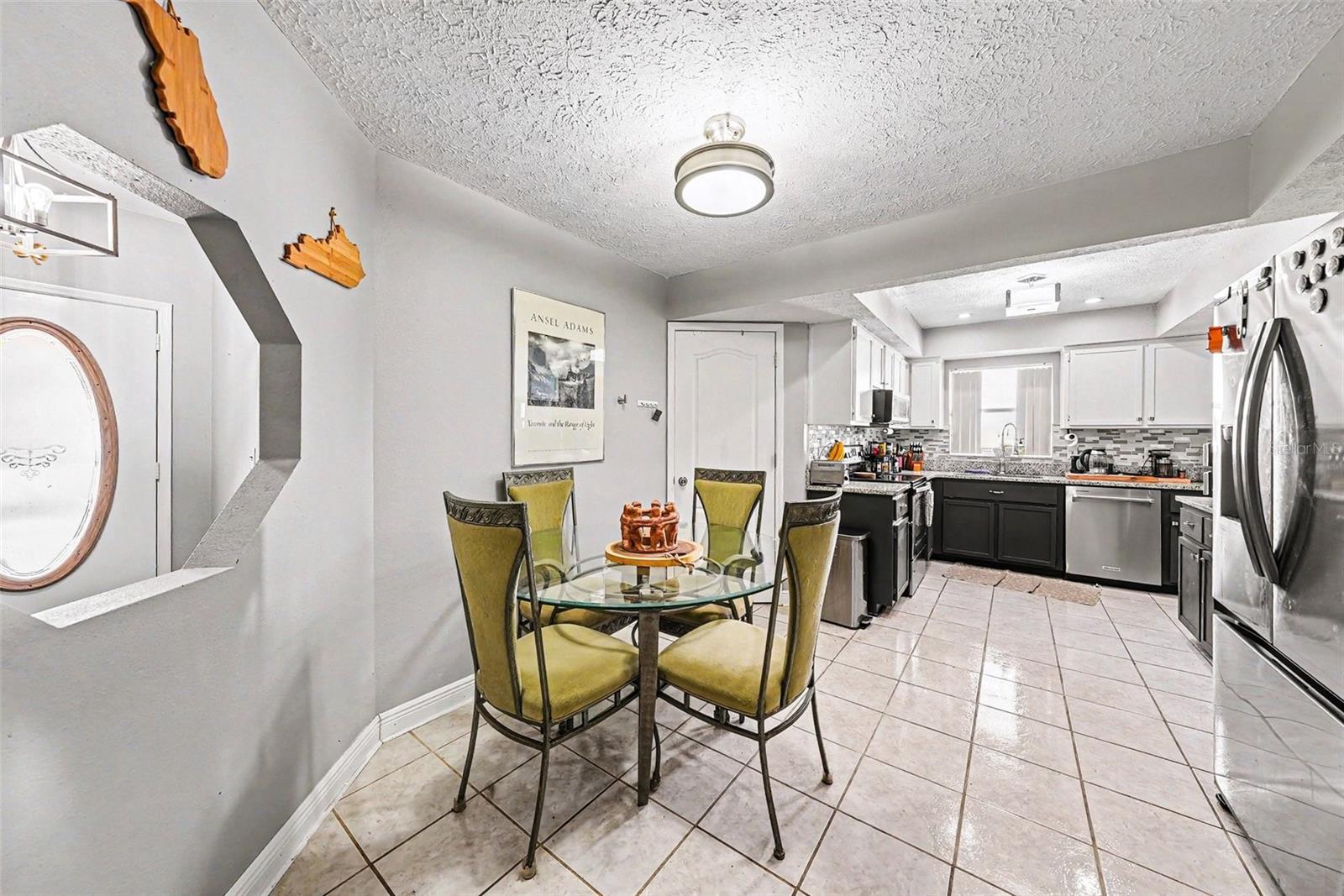 Eating space within kitchen and entry to Laundry Room/garage