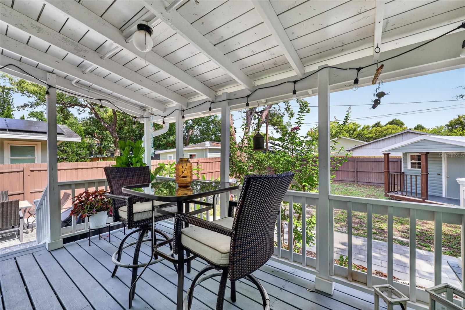 Covered outdoor porch good for relaxing and outdoor dining