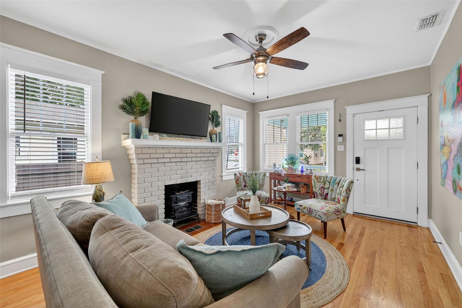Spacious modern living room with a brick built-in fireplace