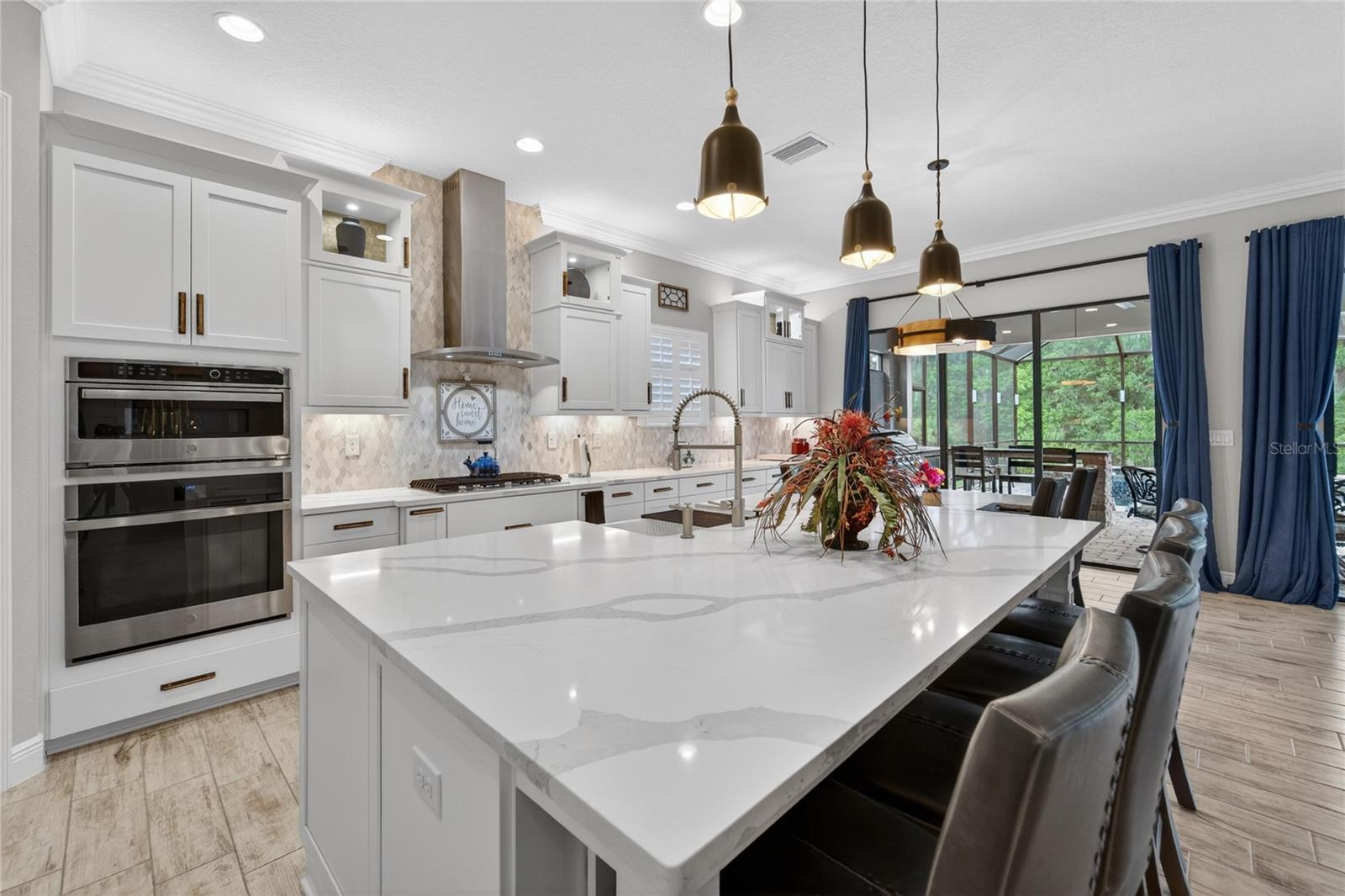 Owners added beautiful tile backsplash and brass cabinet pulls.