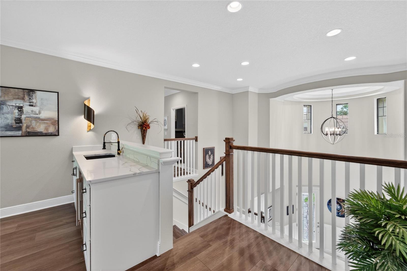 Second Floor Landing and view of wet bar.