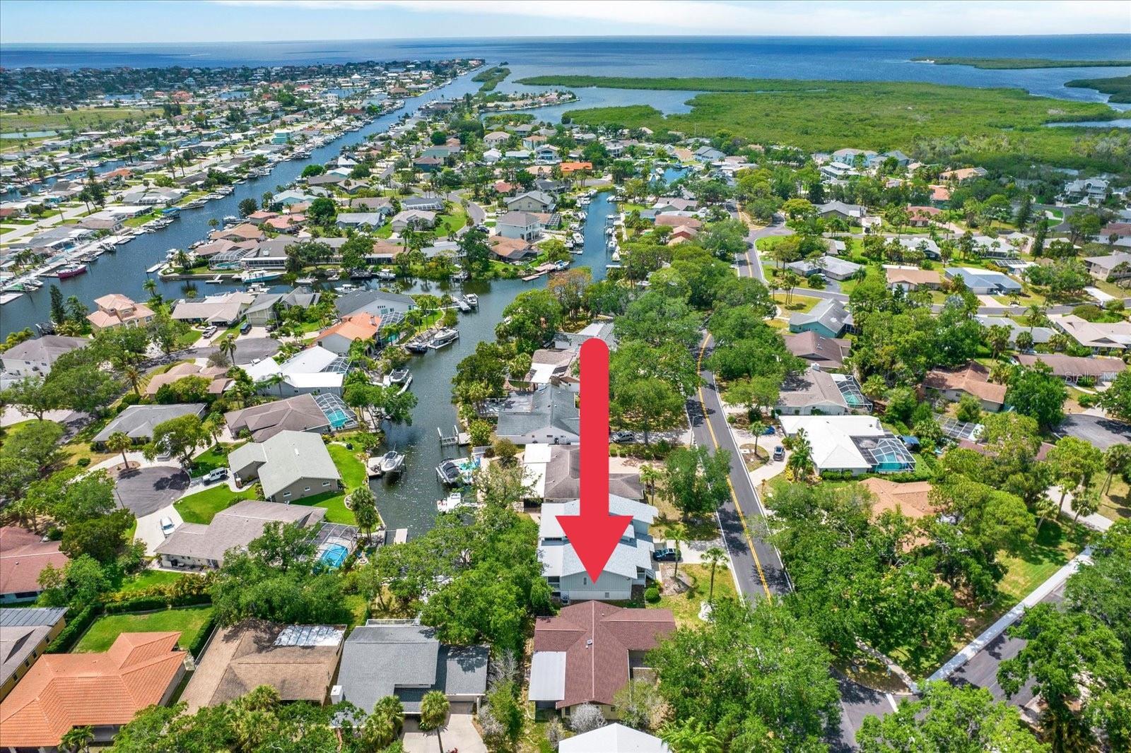 Areal overview highlighting  the property's prime location within a premier waterfront neighborhood, offering quick and easy access to open water.
